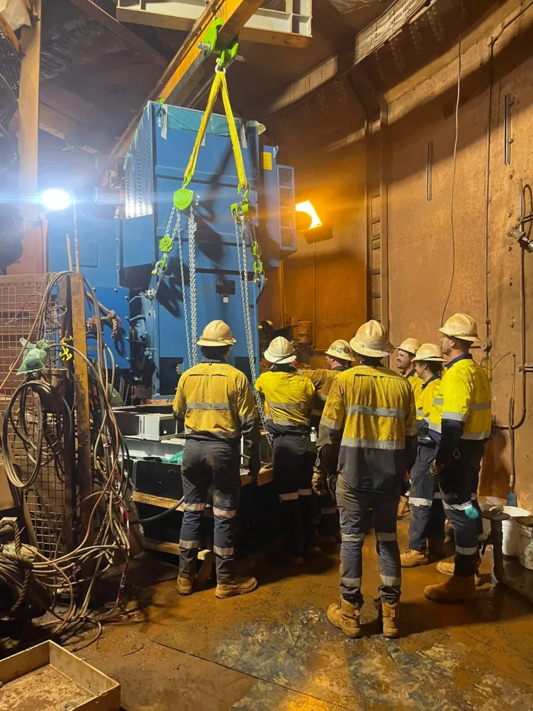 ALS International rigging crew performing a confined-space machinery lift with chain hoist