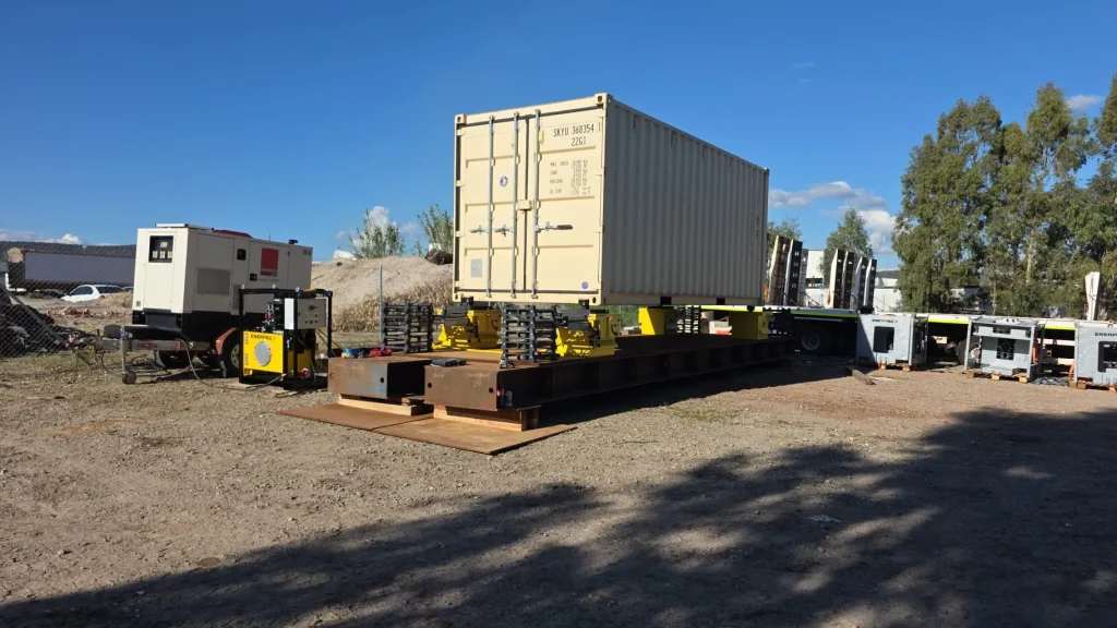 Shipping container mounted on a steel skid frame with generators at an ALS International yard